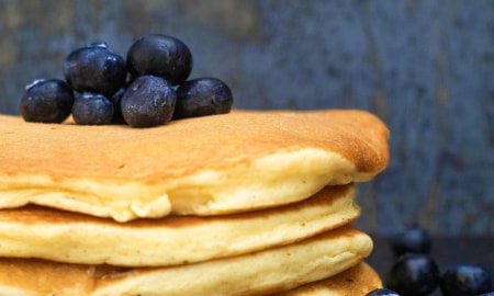A stack of blueberry pancakes