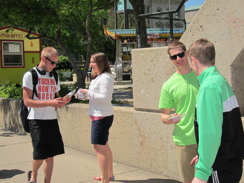 Chapel students hand out cookies to their fellow classmates on the UW-Madison campus at Library Mall