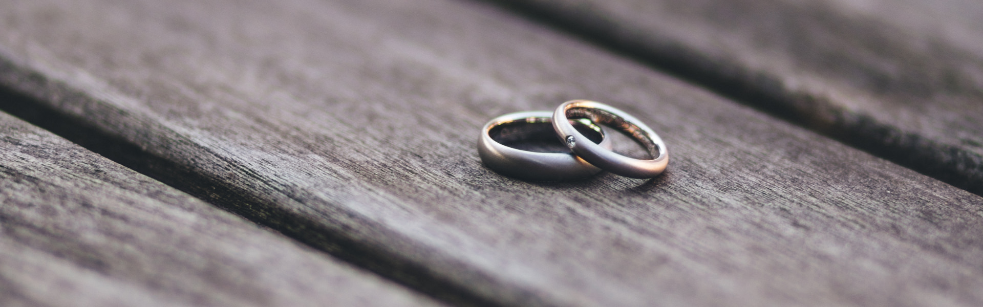 Pair of wedding rings on a plank board